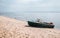 River landscape. Fishing boat on a deserted shore