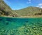 River landscape split over under rock underwater