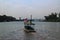 River landscape with wooden boats for towing and sailing on large rivers.  At the Chao Phraya River, Nakhon Sawan, Thailand