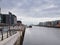 River Liffey from Samuel Beckett Bridge towards Dublin Docks and Poolbeg Chimneys.