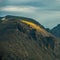 River of Light Spills Over Jagged Cliffs Of Rocky Mountain