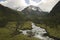 River of melted water of the Tullparahu glacier flowing down the valley of Quillcayhuance, Peru.