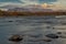 The river and the mountains beyond at sunset.