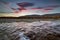 The river and the mountains beyond at sunset.