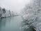 A river in the mountains with snow along the banks