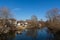 River Nisava and houses by the river on a sunny winter day on the outskirts of the city