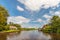 River with old houses in Dutch national park Weerribben