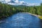 The river Ore in Sweden flushing through green forests