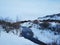 River on the plain in Iceland. The banks are covered with snow. Winter landscape, open spaces