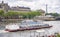 River pleasure boat moves along the banks of the Seine in Paris