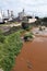 A river polluted with waste from a nearby factory