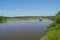 A river with a pontoon bridge. Russian nature, water, forest