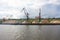 River port cranes in cargo port loading bulk materials
