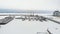 River port, standing of cargo ships, vessel with a crane, winter, aerial survey, top view