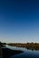 The river with a quiet current and clouds reflected in it, Soz , Gomel, Belarus