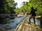 River rafting in the Thai jungle over a bamboo bundle. Calm river.