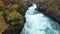 river rapids at huka falls near taupo or rotorua north island new zealand, landscape with water, rocks and trees