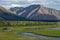 River reach in a broad mountain valley.