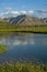 River reach in a broad mountain valley.