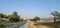 River running through a lush, rural landscape