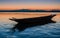 River\\\'s Embrace: Evening Silhouette of a Boat on the River