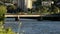 River`s waves in sunlight, water flow, transport movement and bridge in Tbilisi, Georgia.