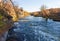 River section with rocky shore at late autumn