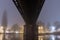 A River Severn, Under a railway bridge on a misty winters night. Worcester, UK