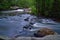 River with small dam time exposure