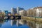 River Spree embankment Helgolaender Ufer with the Moabiter bridge, Spree-Bogen and the Ameron Hotel Abion in Berlin