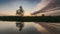 River in spring at dawn. Reflection of clouds in water