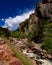 River at state park in colorado on a sunny day with mountains in background