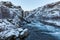 River streaming from the Glymur waterfall  in Iceland in winter