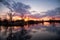 River during the sunset quietly flowing flows through the spring forest in April