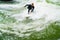 River surfers on Eisbach River in middle of European city.