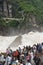 river surging in canyon scenery with tourist at Tiger leaping gorge