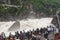 river surging in canyon scenery with tourist at Tiger leaping gorge