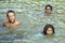 In the river swimming children in tropical Brazil