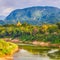 River, temple and mountains. Beautiful landscape. Laos.