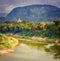 River, temple and mountains. Beautiful landscape. Laos.
