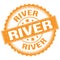 RIVER text on orange round stamp sign