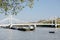 River Thames London from Chelsea Embankment with Albert Bridge and barges