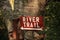 River trail hiking sign on birch tree