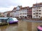 River tram with tourists on a water canal on ancient houses background. River view. Strasbourg city, France. Famous