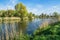 River, trees and blue sky. Beautiful spring landscape in Poland