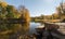 River with trees and fields in fall colors in the Adirondacks