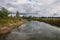 River, trees, grass and clouds