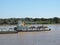 River Tug - Pusher `AGUARA` and convoy of bardes loaded in navigation along of the Water Way Hidrovia rivers Paraguay Parana