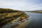 River valley in Russia, clear water with a sandy bottom, forest on the shore.