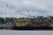 River view of the port of Manaus with a lot of colorful stacked containers and cranes. Location: Manaus, Brazil